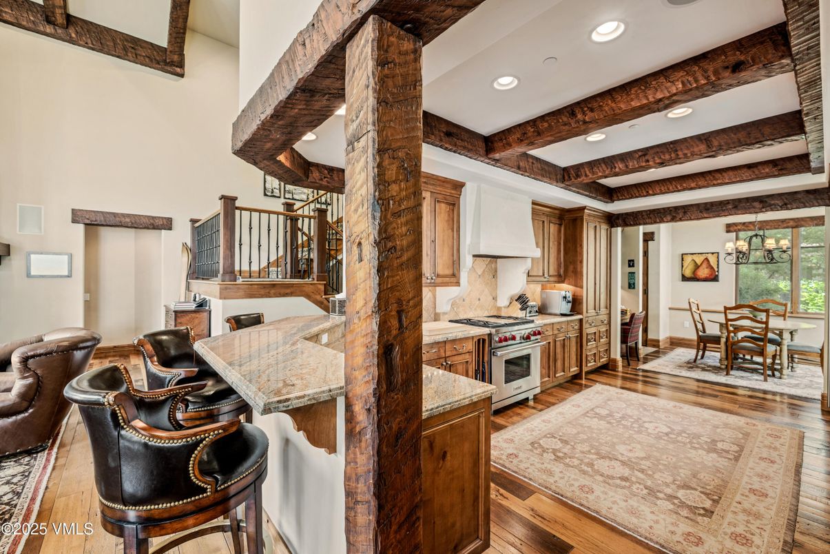 Chandelier, Dining room, Interior, Kitchen, Recessed Lighting, Stainless Steel Appliances, Wooden Beams, Wood Texture Flooring