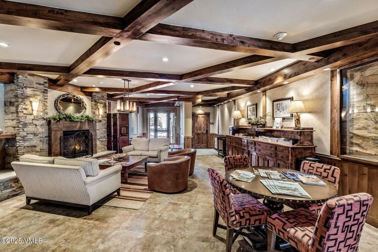 Dining room, Fireplace, Interior, Living room, Pendant Lights, Recessed Lighting, Stone Walls, Wooden Beams