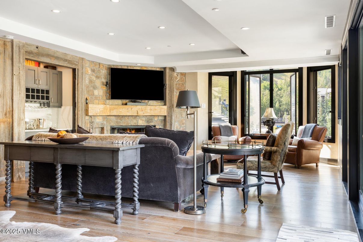 Fireplace, Interior, Living room, Recessed Lighting, Stone Walls, Wood Texture Flooring