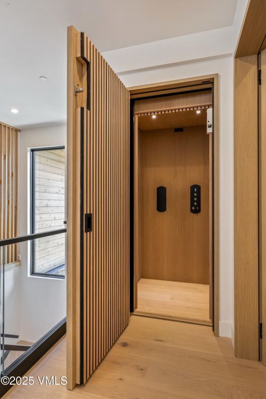 Elevator, Interior, Recessed Lighting, Wood Texture Flooring, Wooden Walls