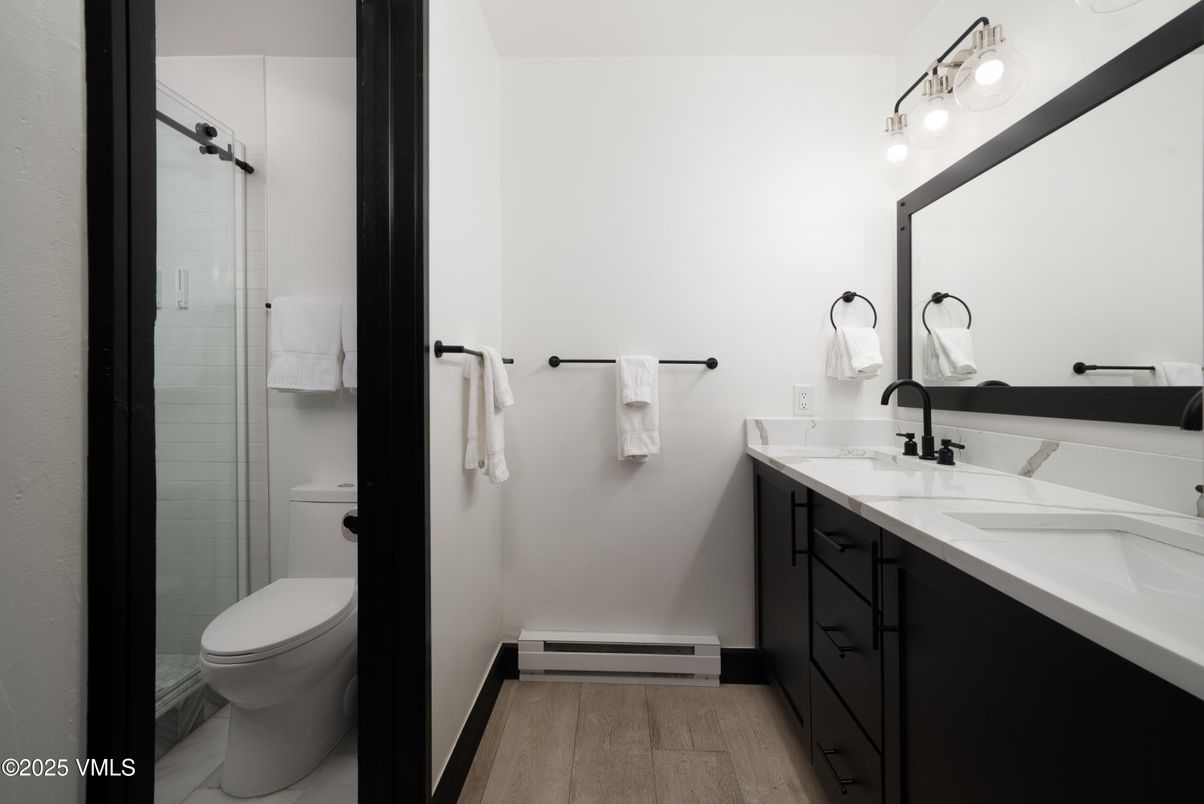 Bathroom, Dual Sink Vanities, Glass Shower, Interior, Wood Texture Flooring