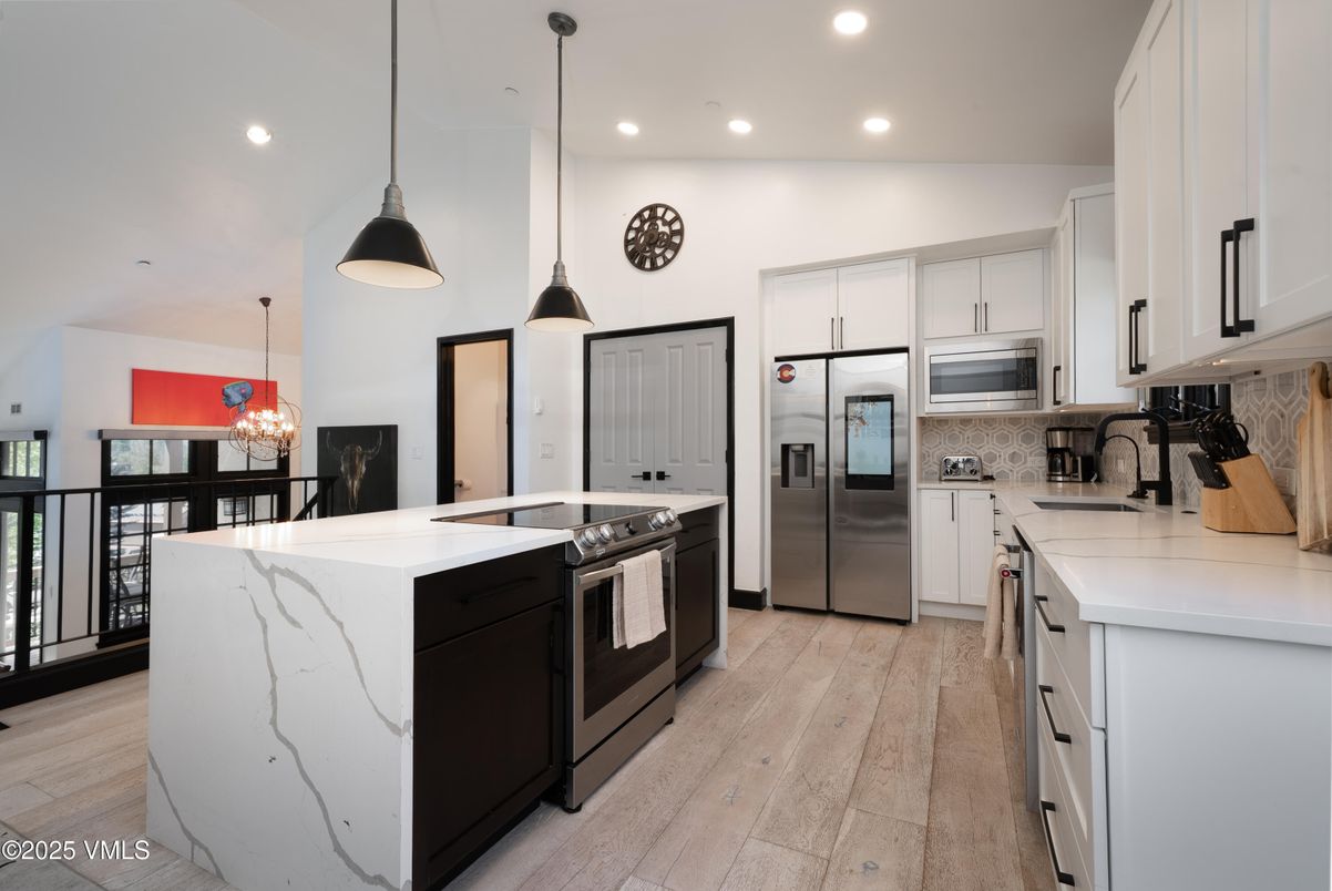 Chandelier, Interior, Kitchen, Pendant Lights, Recessed Lighting, Stainless Steel Appliances, Wood Texture Flooring