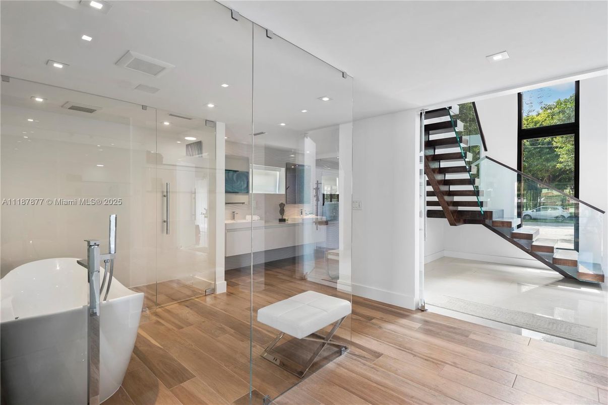 Bathroom, Free Standing Baths, Glass Shower, Interior, Recessed Lighting, Wood Texture Flooring