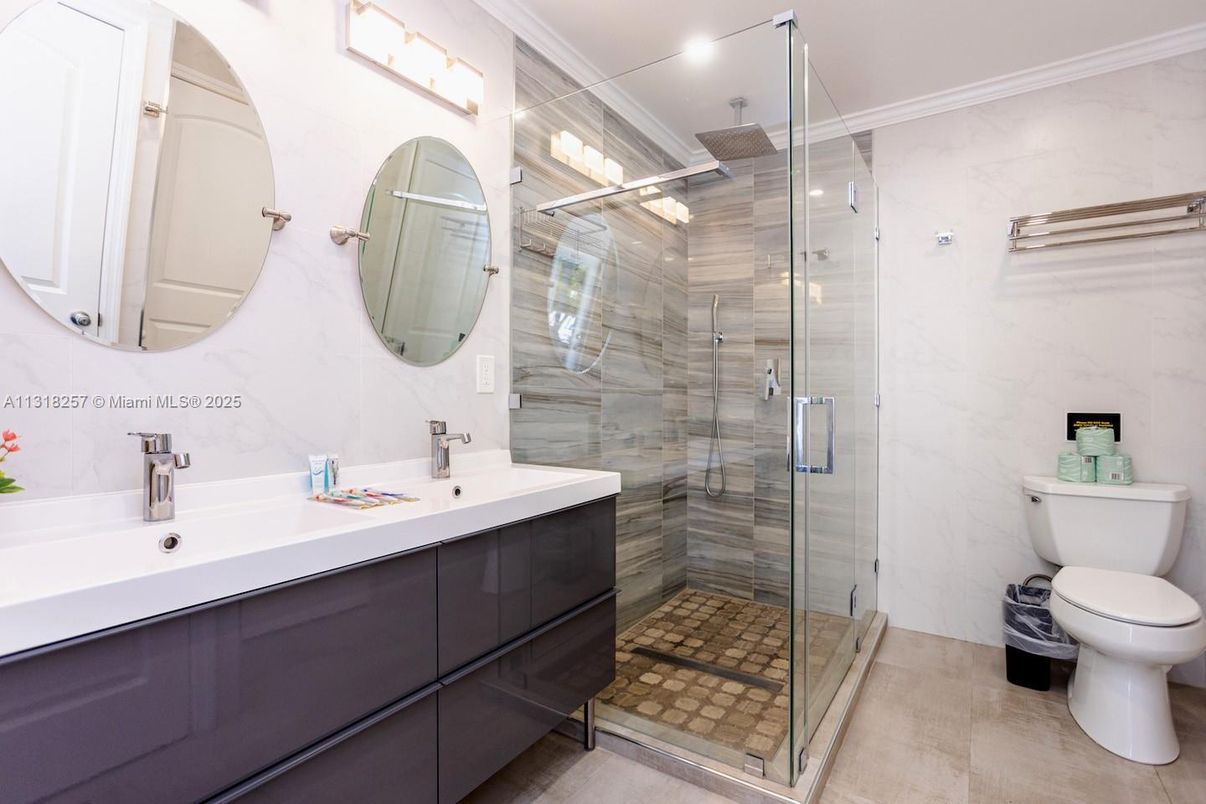 Bathroom, Dual Sink Vanities, Glass Shower, Interior, Marble Walls, Recessed Lighting