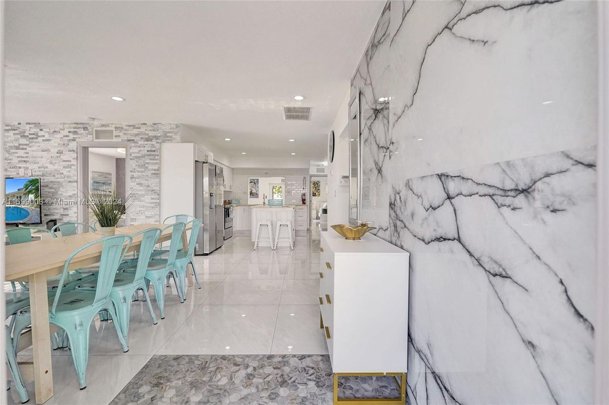 Dining room, Interior, Kitchen, Marble Walls, Recessed Lighting, Stainless Steel Appliances, Stone Walls