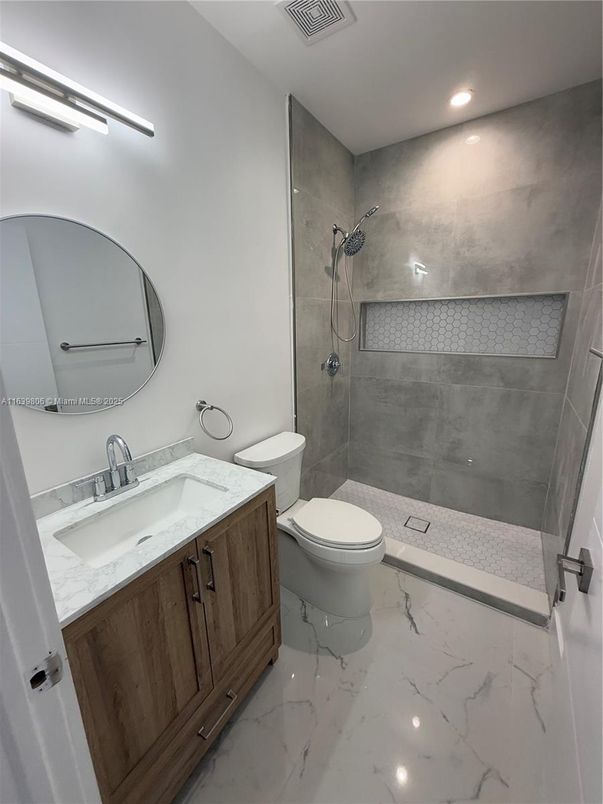 Bathroom, Dual Sink Vanities, Glass Shower, Interior, Marble, Recessed Lighting