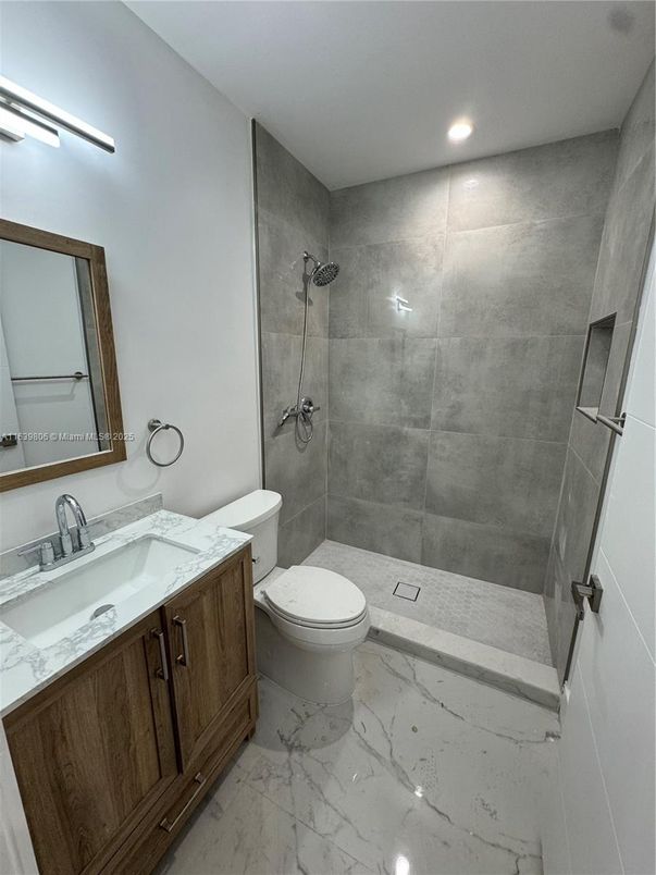 Bathroom, Dual Sink Vanities, Glass Shower, Interior, Marble, Recessed Lighting