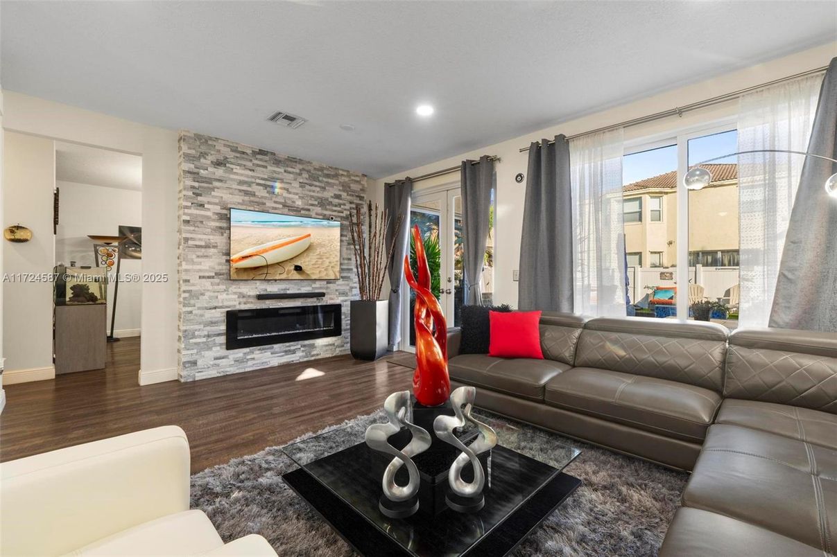 Fireplace, Interior, Living room, Recessed Lighting, Stone Walls, Wood Texture Flooring