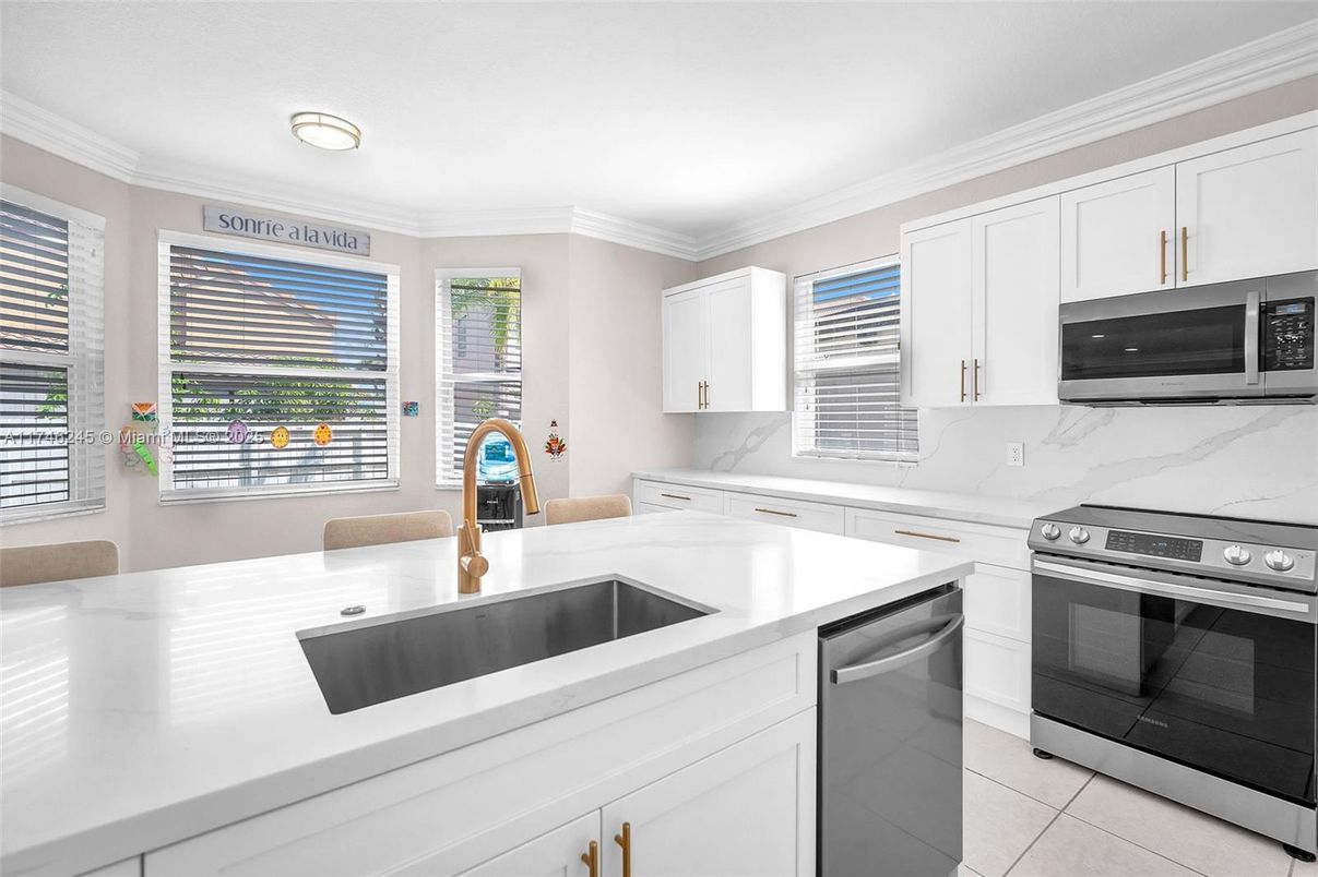 Interior, Kitchen, Marble Walls, Recessed Lighting, Stainless Steel Appliances