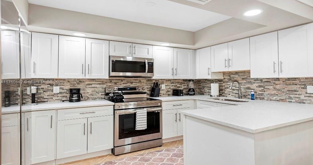 Interior, Kitchen, Recessed Lighting, Stainless Steel Appliances, Stone Walls