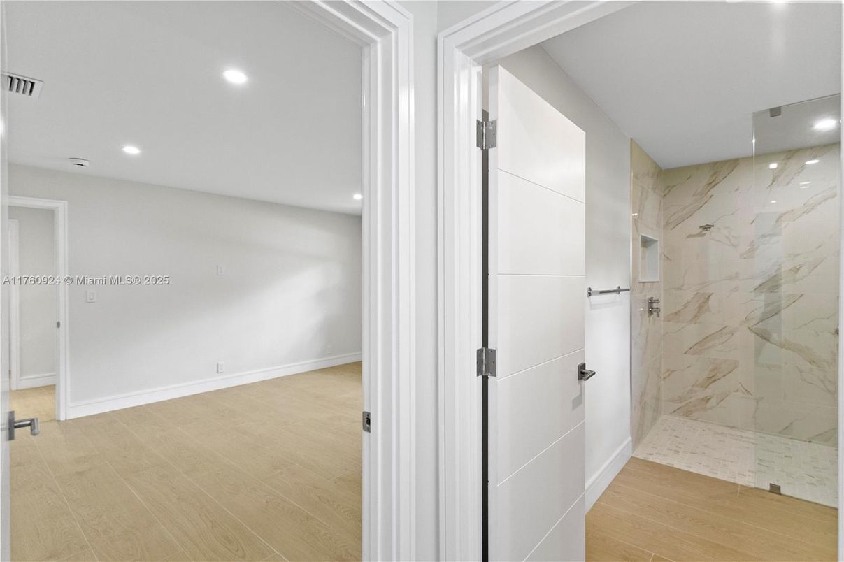 Bathroom, Glass Shower, Interior, Marble Walls, Recessed Lighting, Wood Texture Flooring
