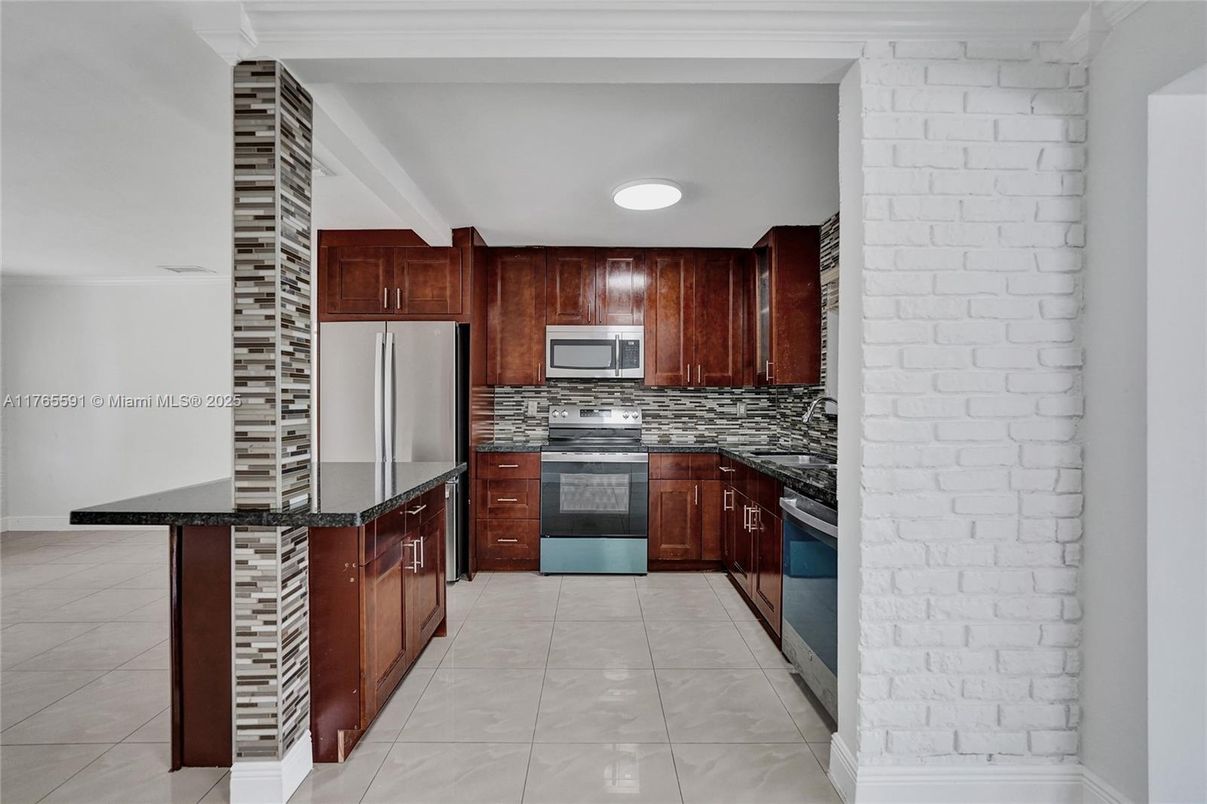 Interior, Kitchen, Recessed Lighting, Stainless Steel Appliances, Stone Walls