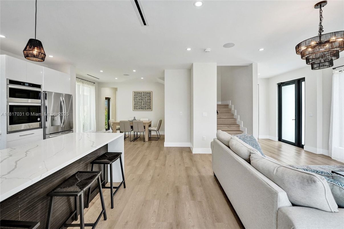 Chandelier, Dining room, Interior, Kitchen, Pendant Lights, Recessed Lighting, Stainless Steel Appliances, Wood Texture Flooring