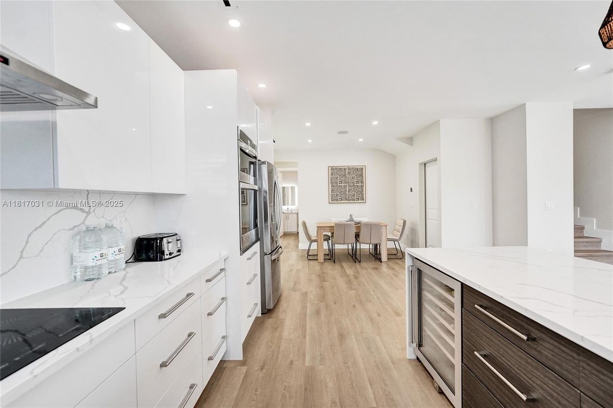 Dining room, Interior, Kitchen, Recessed Lighting, Stainless Steel Appliances, Wood Texture Flooring