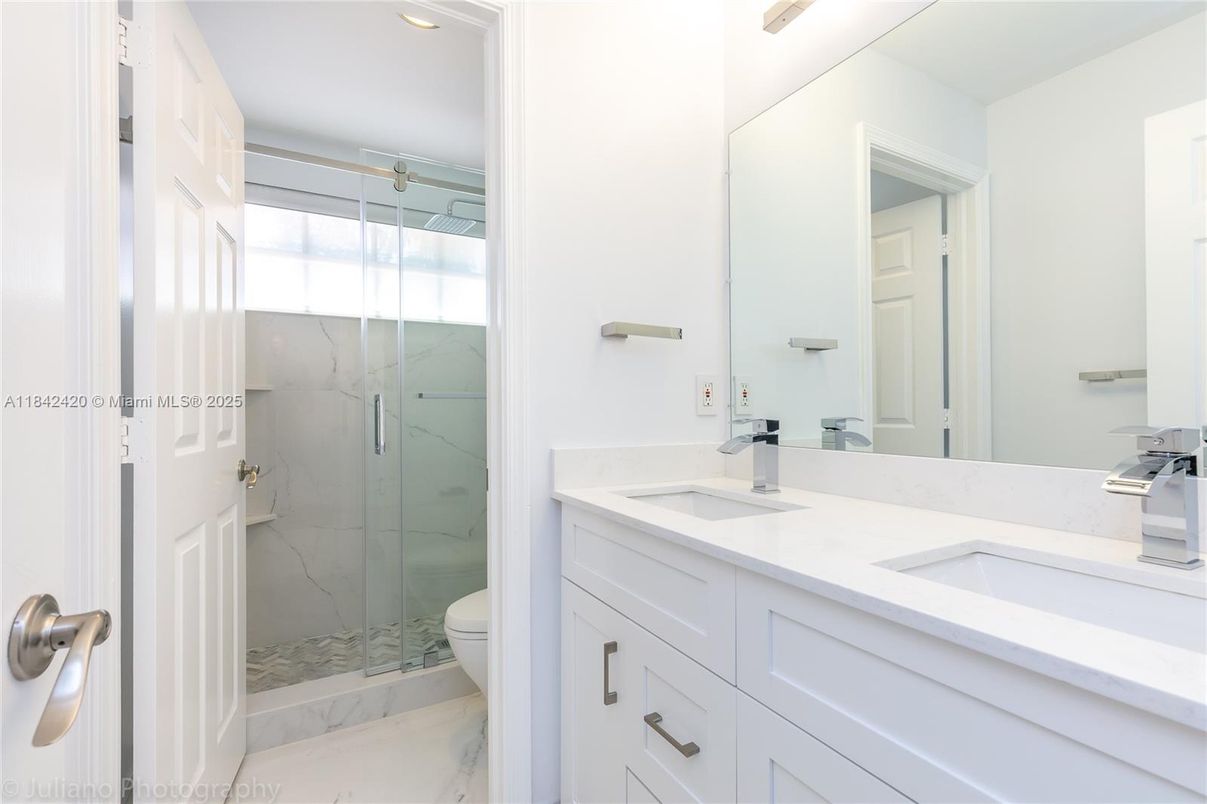 Bathroom, Dual Sink Vanities, Glass Shower, Interior, Marble, Marble Walls, Recessed Lighting