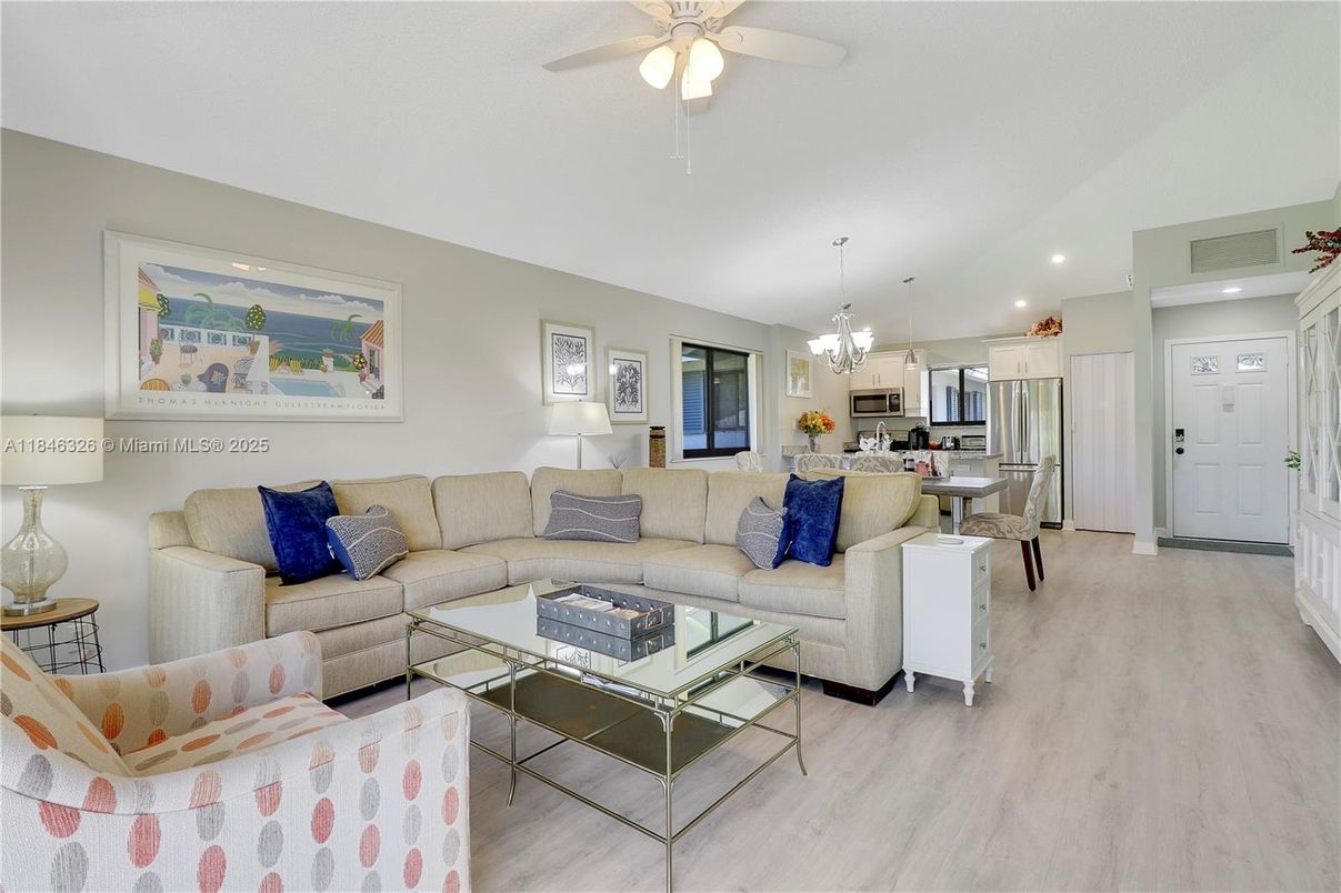 Chandelier, Dining room, Interior, Kitchen, Living room, Pendant Lights, Recessed Lighting, Stainless Steel Appliances, Wood Texture Flooring