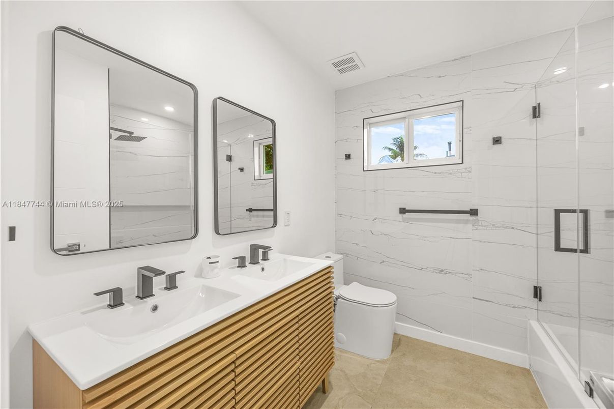 Bathroom, Dual Sink Vanities, Glass Shower, Interior, Marble Walls, Recessed Lighting