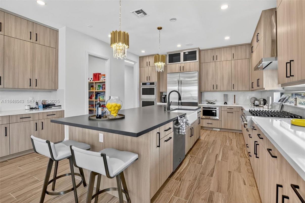 Chandelier, Interior, Kitchen, Pendant Lights, Recessed Lighting, Stainless Steel Appliances, Wood Texture Flooring