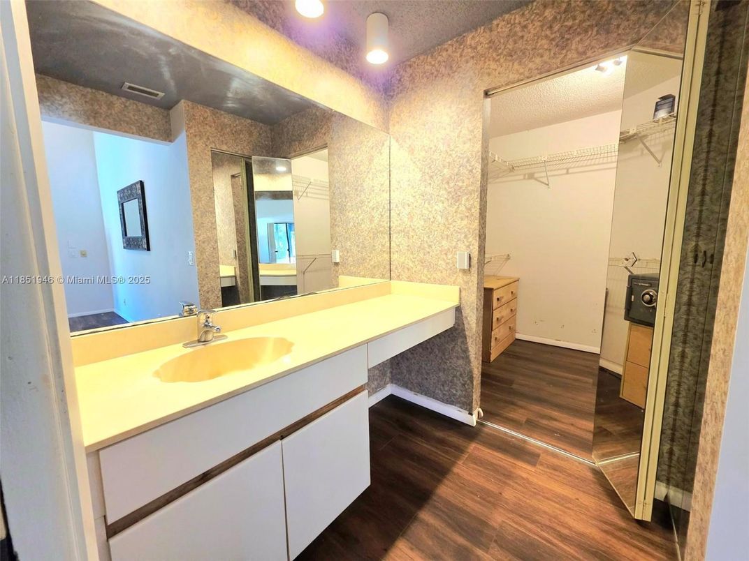Bathroom, Dual Sink Vanities, Interior, Recessed Lighting, Walk-in Closets, Wood Texture Flooring