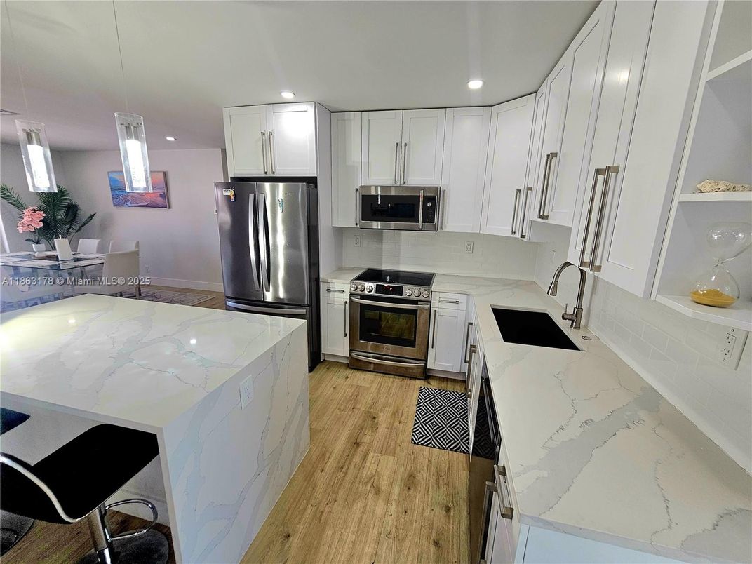 Interior, Kitchen, Pendant Lights, Recessed Lighting, Stainless Steel Appliances, Wood Texture Flooring