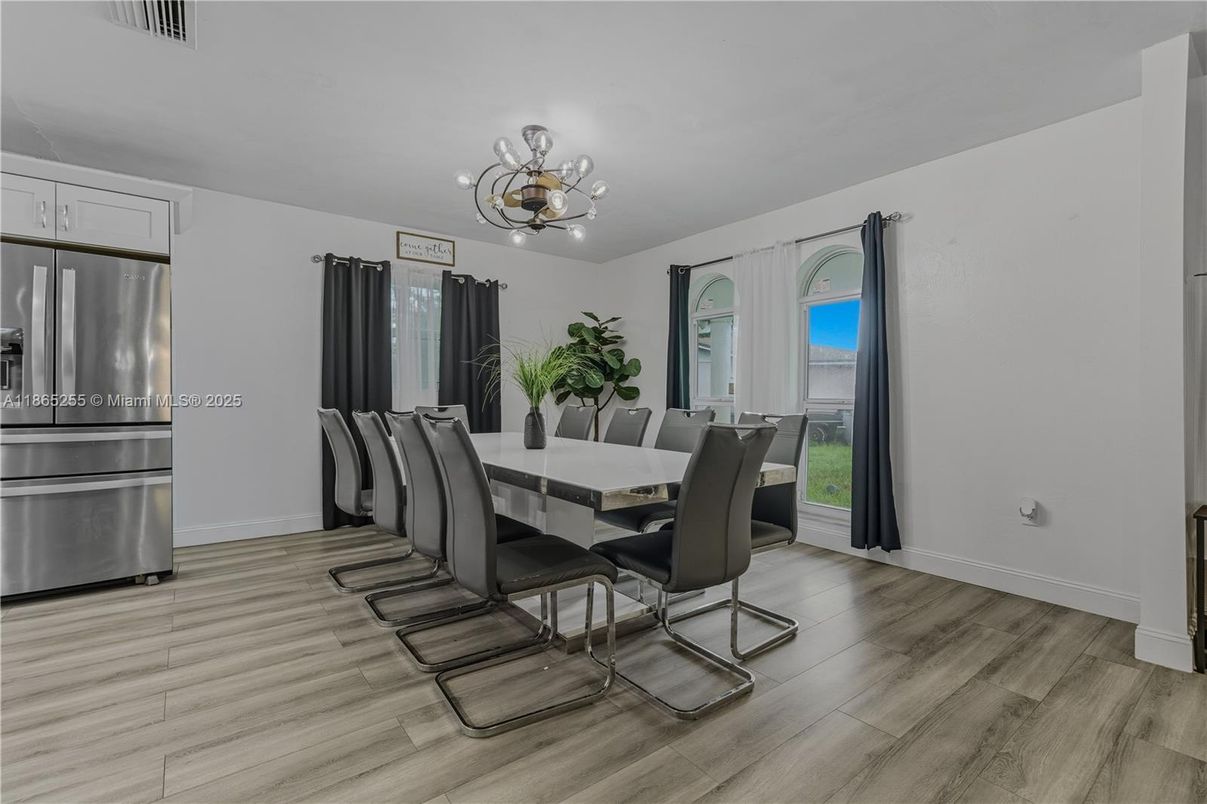 Chandelier, Dining room, Interior, Stainless Steel Appliances, Wood Texture Flooring