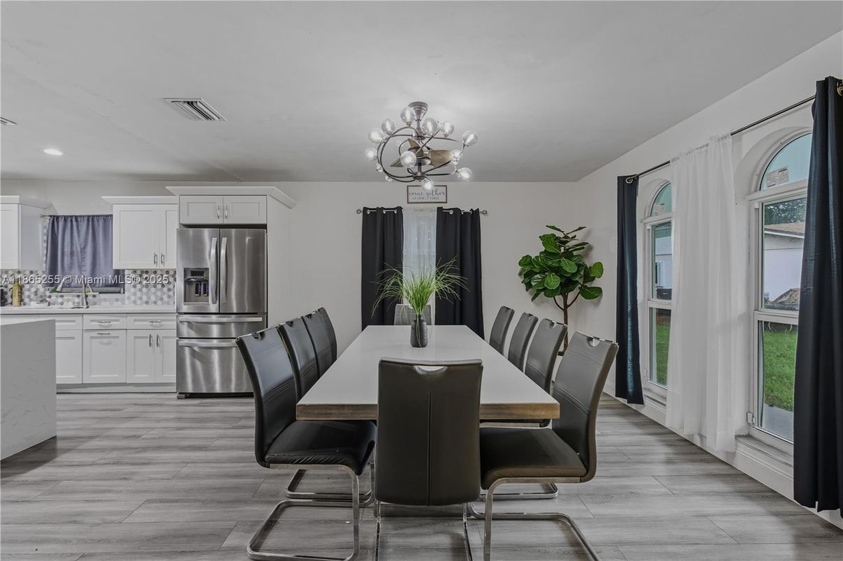 Chandelier, Dining room, Interior, Kitchen, Recessed Lighting, Stainless Steel Appliances, Wood Texture Flooring