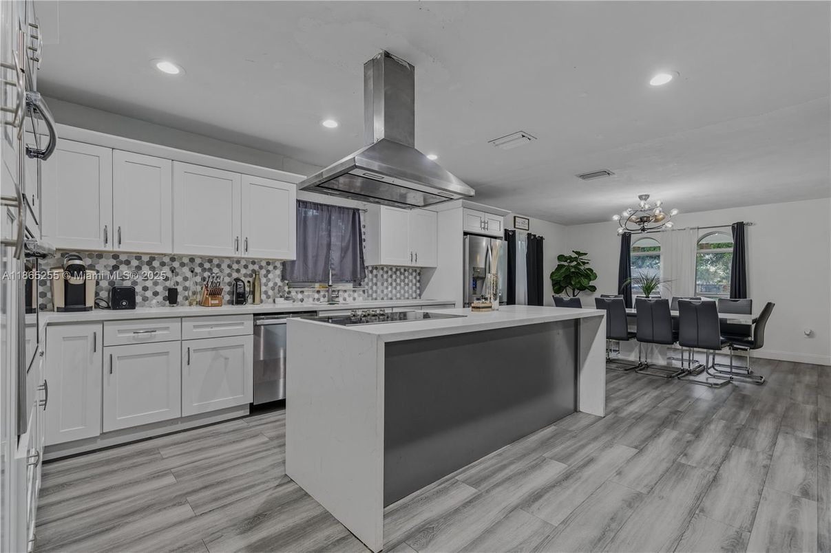 Dining room, Interior, Kitchen, Recessed Lighting, Stainless Steel Appliances, Wood Texture Flooring