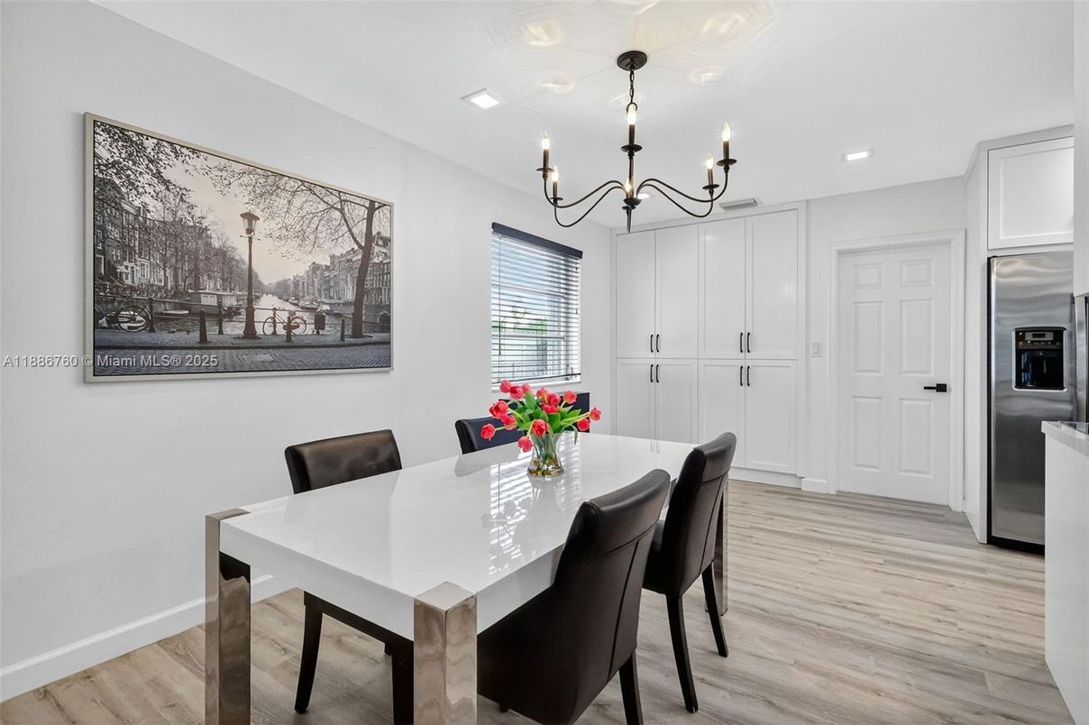 Chandelier, Dining room, Interior, Kitchen, Recessed Lighting, Stainless Steel Appliances, Wood Texture Flooring