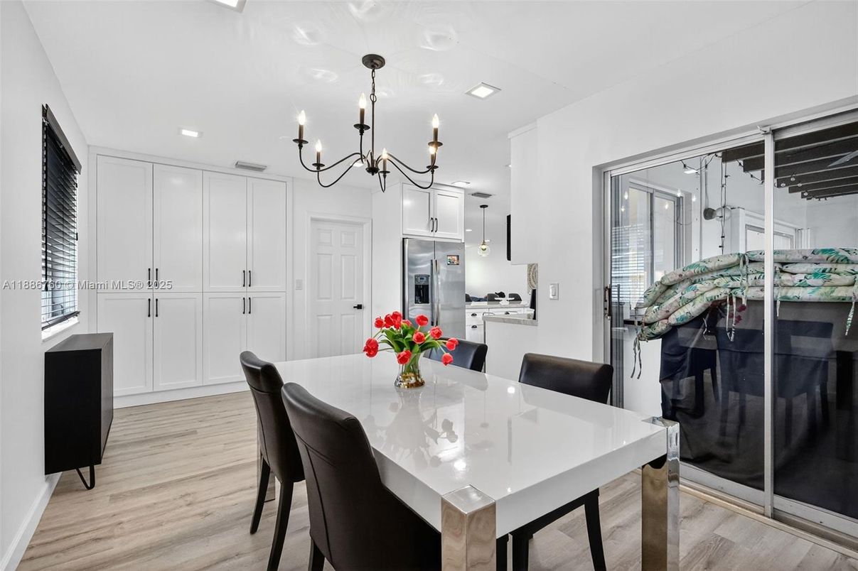 Chandelier, Dining room, Interior, Kitchen, Recessed Lighting, Stainless Steel Appliances, Wood Texture Flooring