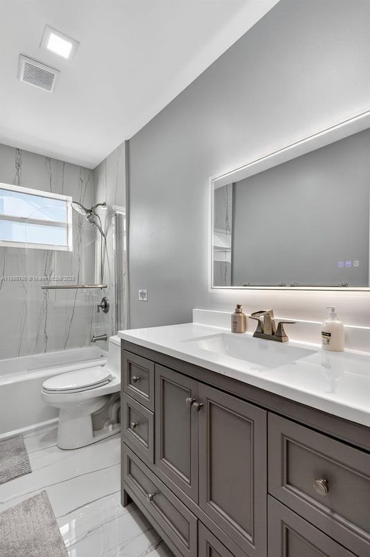 Bathroom, Dual Sink Vanities, Interior, Marble, Marble Walls, Recessed Lighting