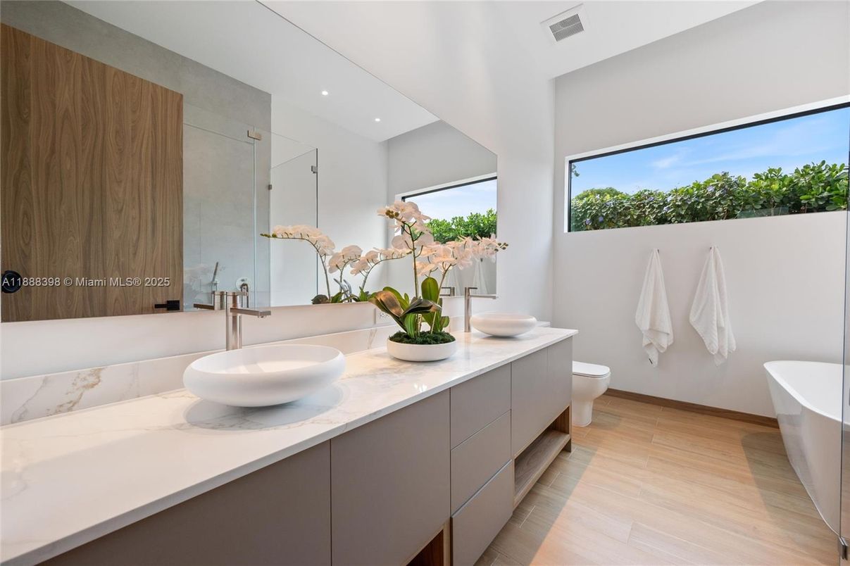 Bathroom, Dual Sink Vanities, Free Standing Baths, Interior, Recessed Lighting, Wood Texture Flooring