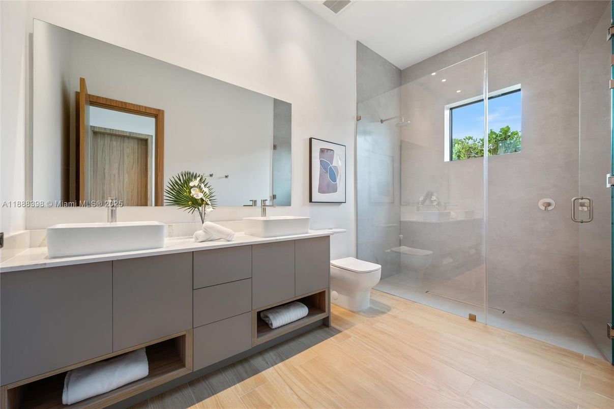 Bathroom, Dual Sink Vanities, Glass Shower, Interior, Recessed Lighting, Wood Texture Flooring