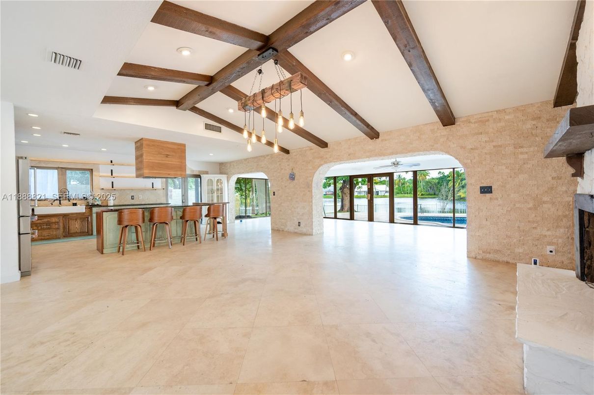 Empty room, Fireplace, Interior, Kitchen, Pendant Lights, Recessed Lighting, Stone Walls, Wooden Beams