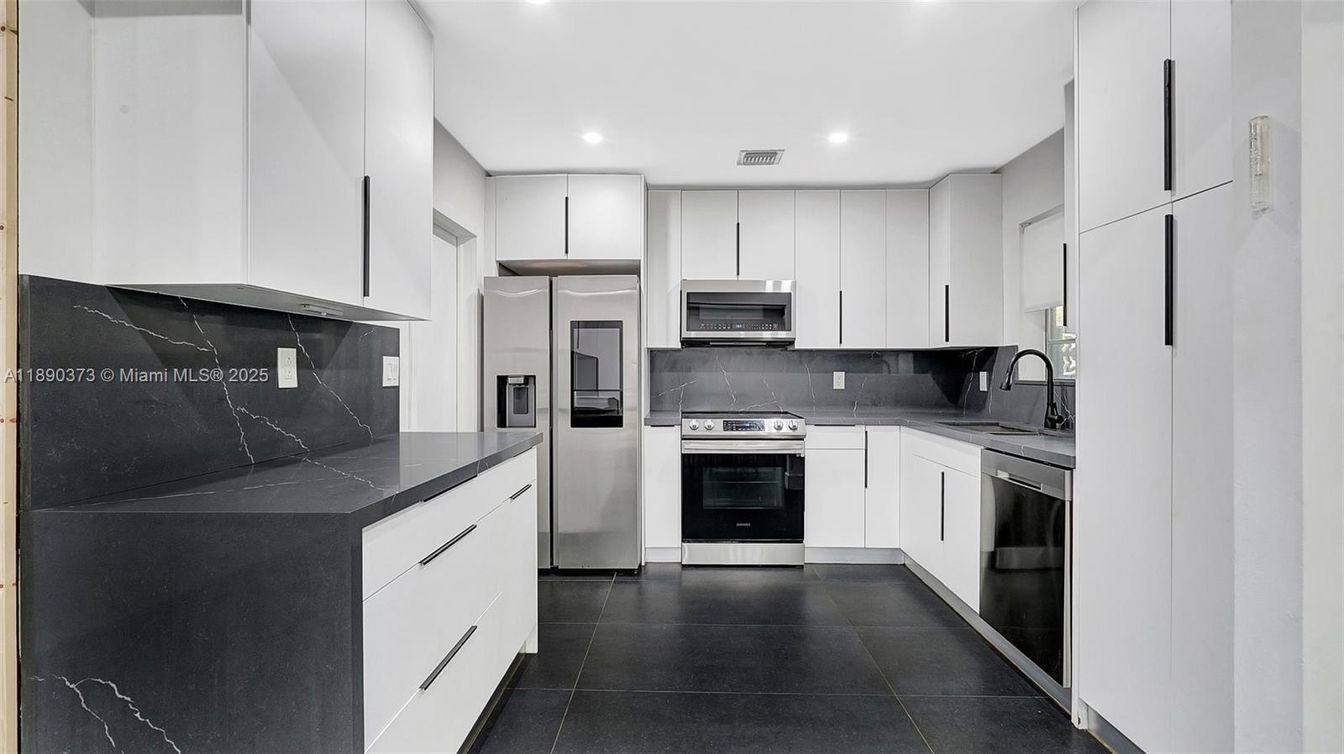 Interior, Kitchen, Marble Walls, Recessed Lighting, Stainless Steel Appliances