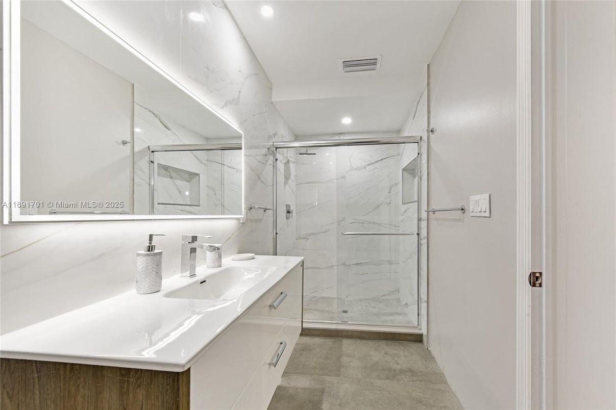 Bathroom, Dual Sink Vanities, Glass Shower, Interior, Marble Walls, Recessed Lighting