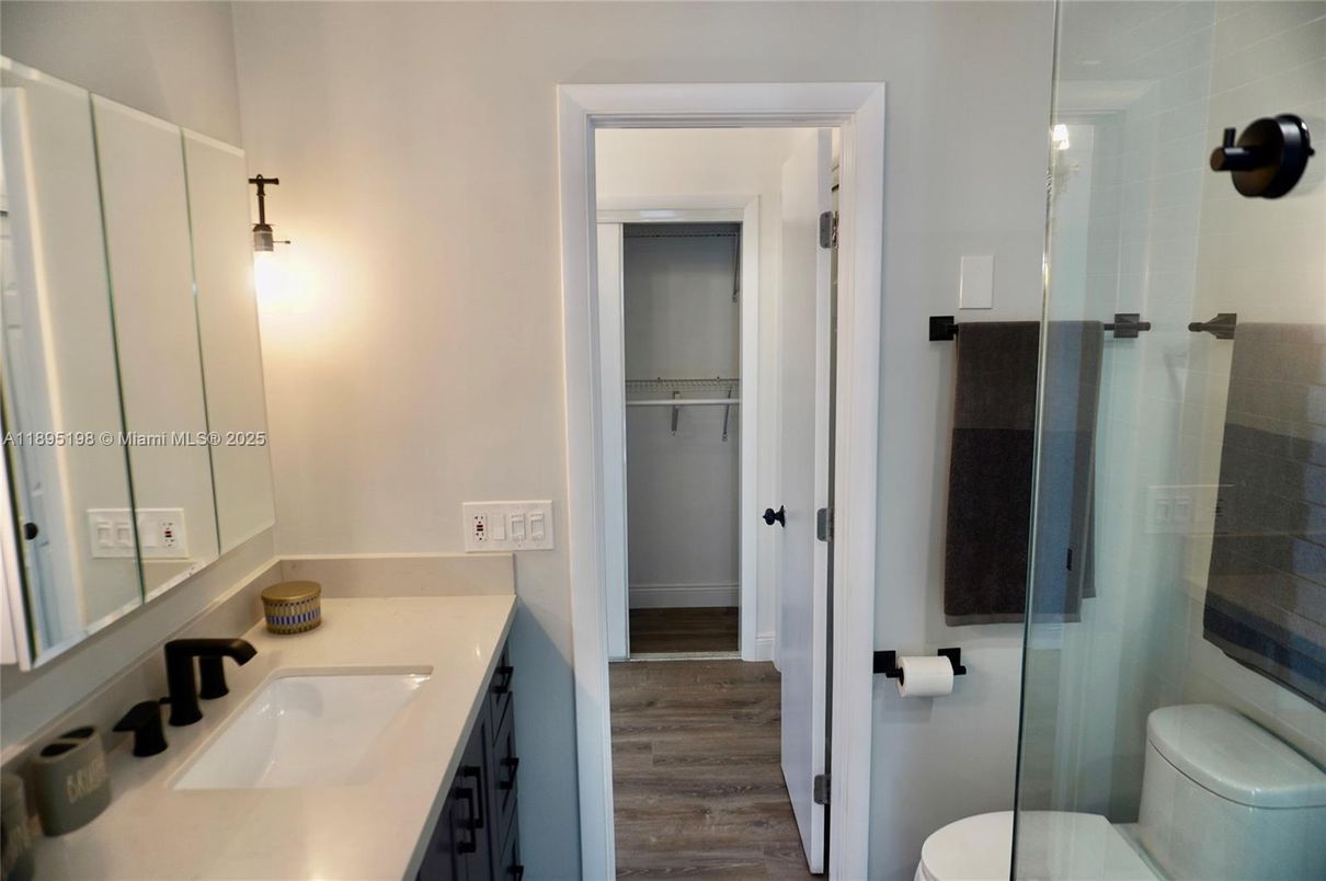 Bathroom, Dual Sink Vanities, Glass Shower, Interior, Wood Texture Flooring