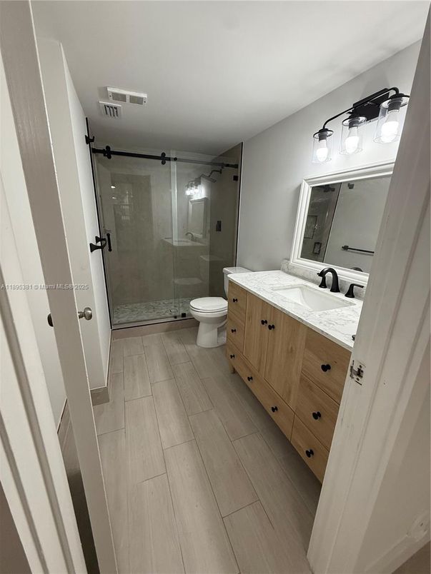 Bathroom, Dual Sink Vanities, Glass Shower, Interior, Wood Texture Flooring
