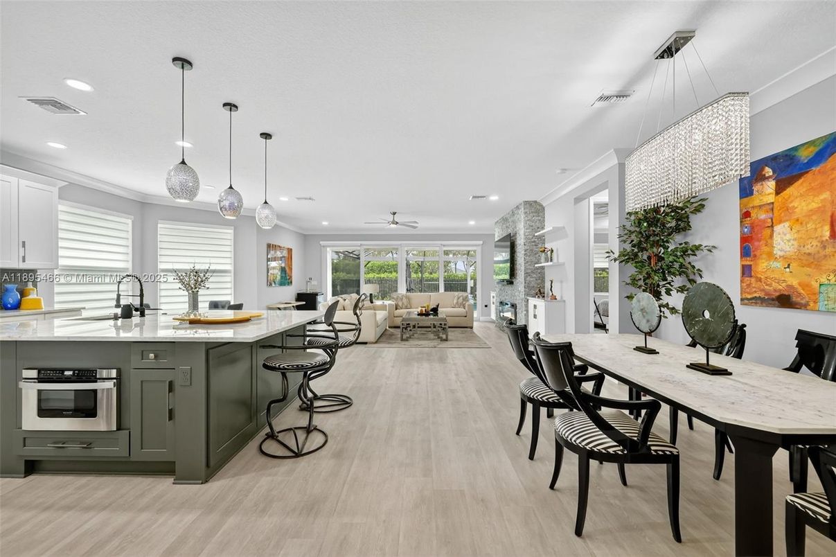 Dining room, Interior, Kitchen, Living room, Pendant Lights, Recessed Lighting, Stainless Steel Appliances, Wood Texture Flooring