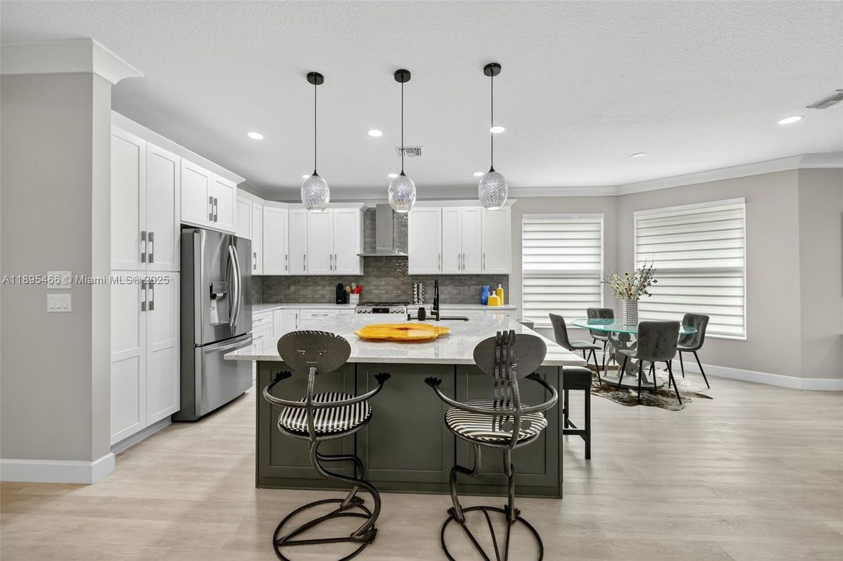 Dining room, Interior, Kitchen, Pendant Lights, Recessed Lighting, Stainless Steel Appliances, Wood Texture Flooring