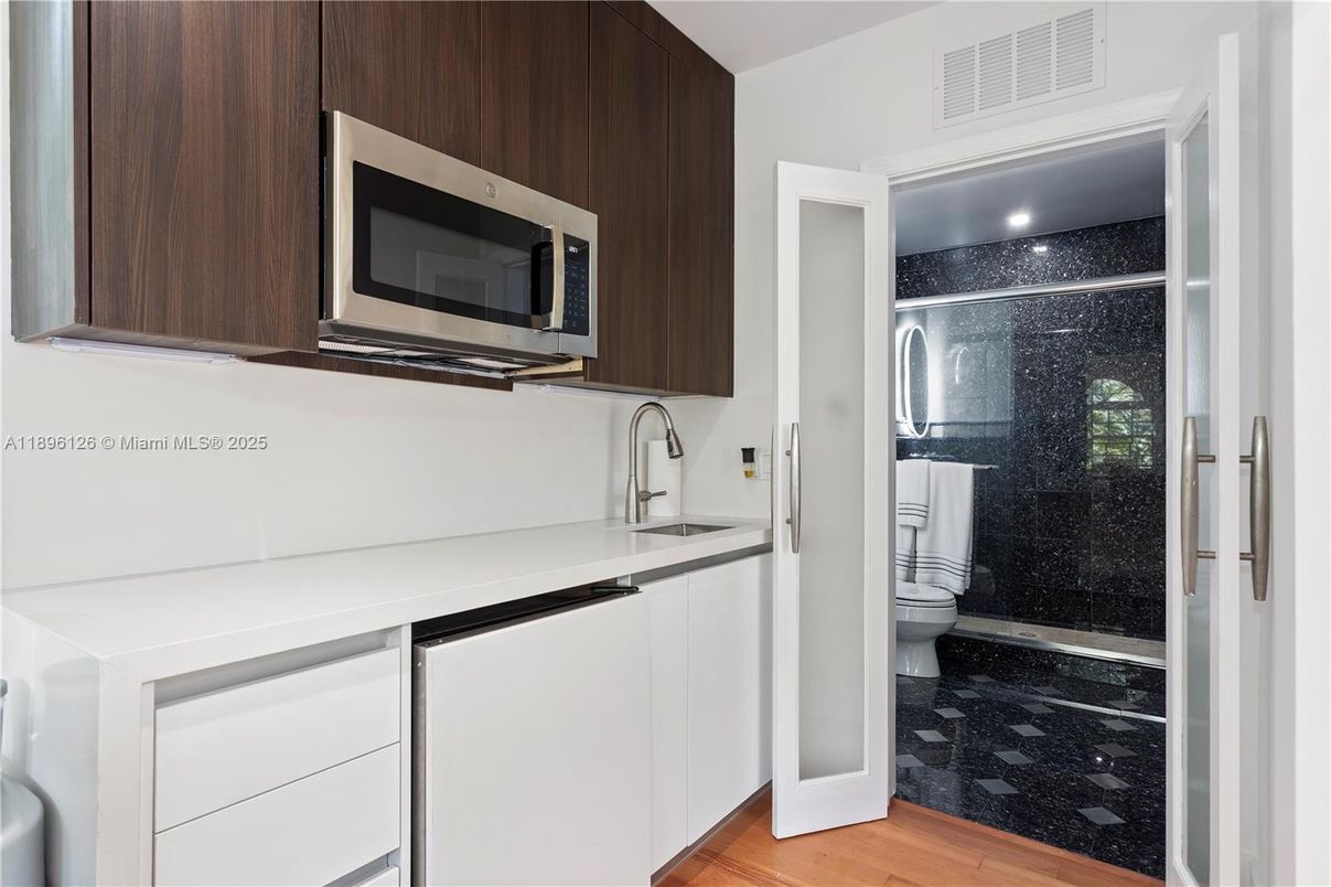 Bathroom, Glass Shower, Interior, Kitchen, Recessed Lighting, Stainless Steel Appliances, Wood Texture Flooring