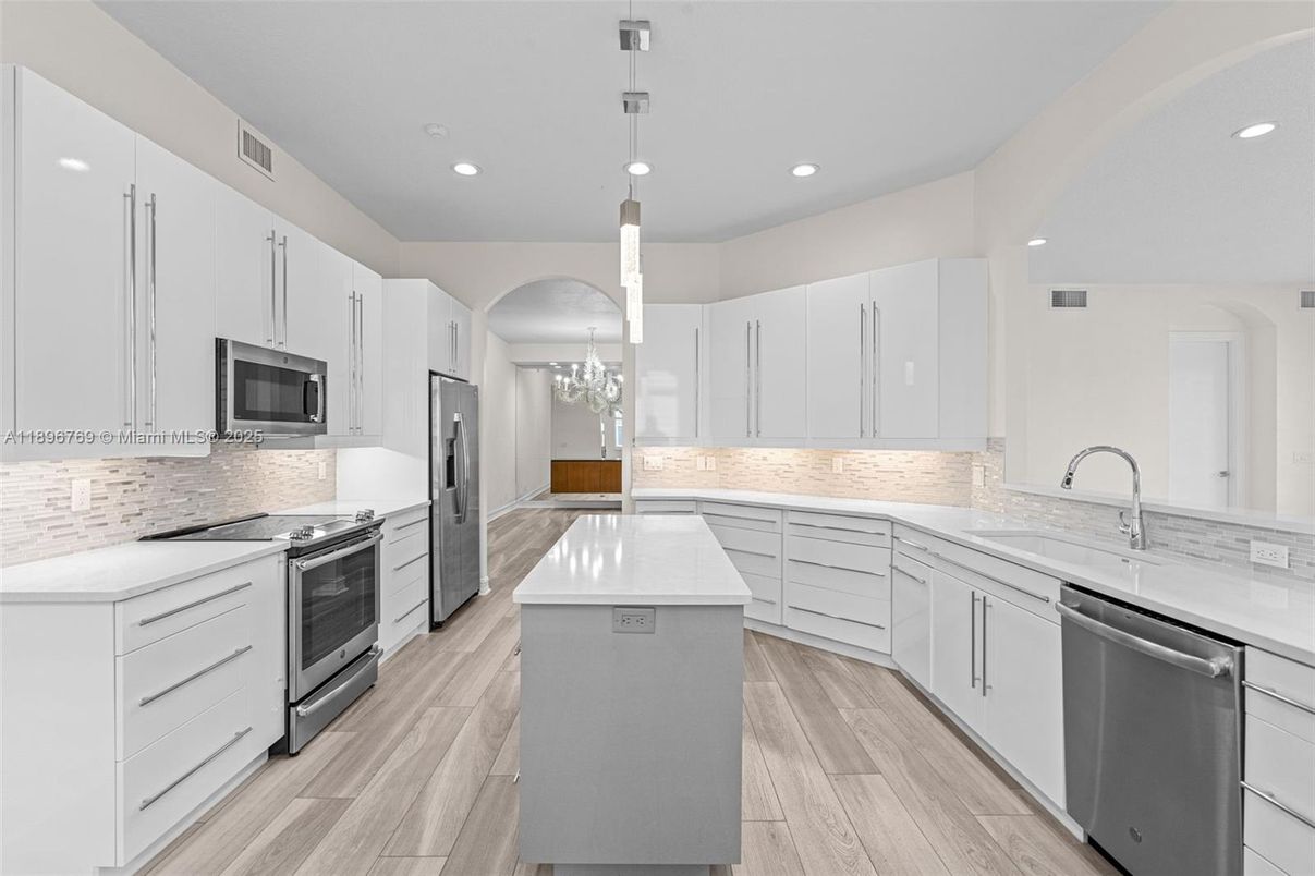 Chandelier, Interior, Kitchen, Pendant Lights, Recessed Lighting, Stainless Steel Appliances, Wood Texture Flooring