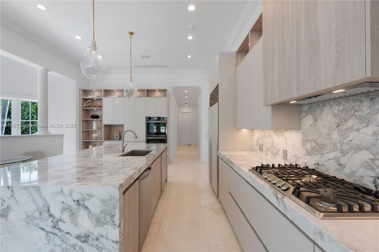Interior, Kitchen, Marble Walls, Pendant Lights, Recessed Lighting, Stainless Steel Appliances