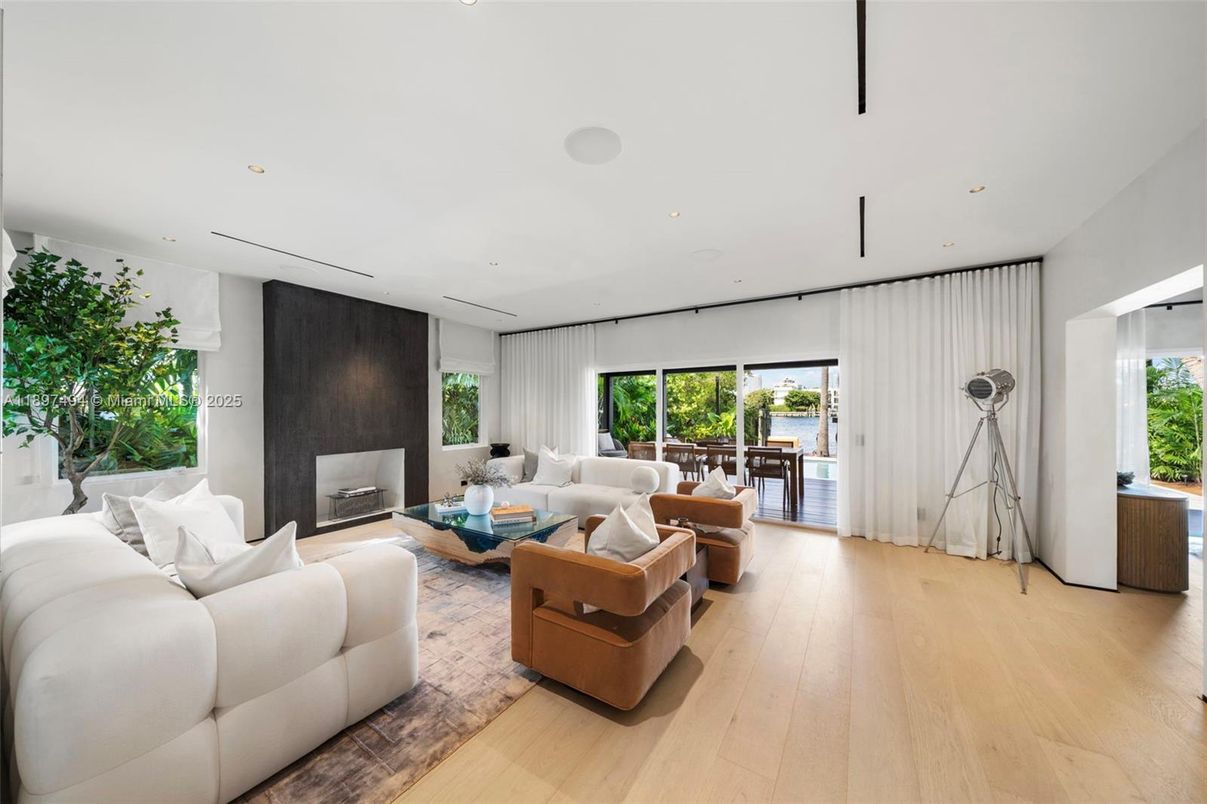 Fireplace, Interior, Living room, Recessed Lighting, Water, Wood Texture Flooring