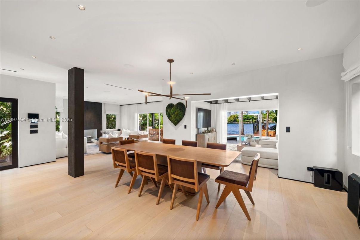 Dining room, Fireplace, Interior, Living room, Pendant Lights, Recessed Lighting, Water, Wood Texture Flooring