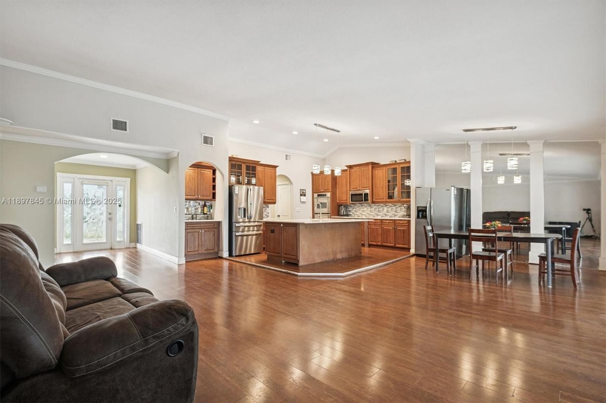 Dining room, Interior, Kitchen, Living room, Pendant Lights, Recessed Lighting, Stainless Steel Appliances, Wood Texture Flooring