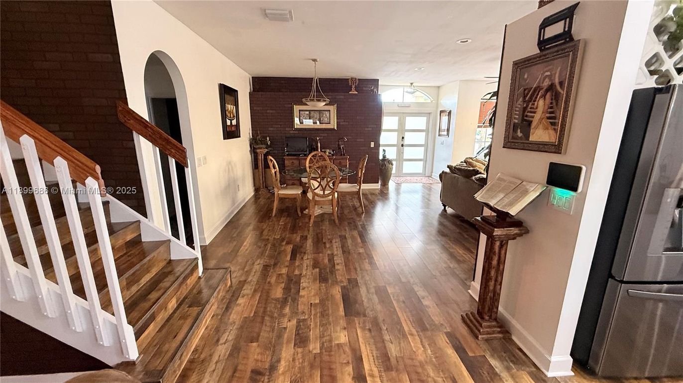 Dining room, Fireplace, Interior, Pendant Lights, Recessed Lighting, Stone Walls, Wood Texture Flooring