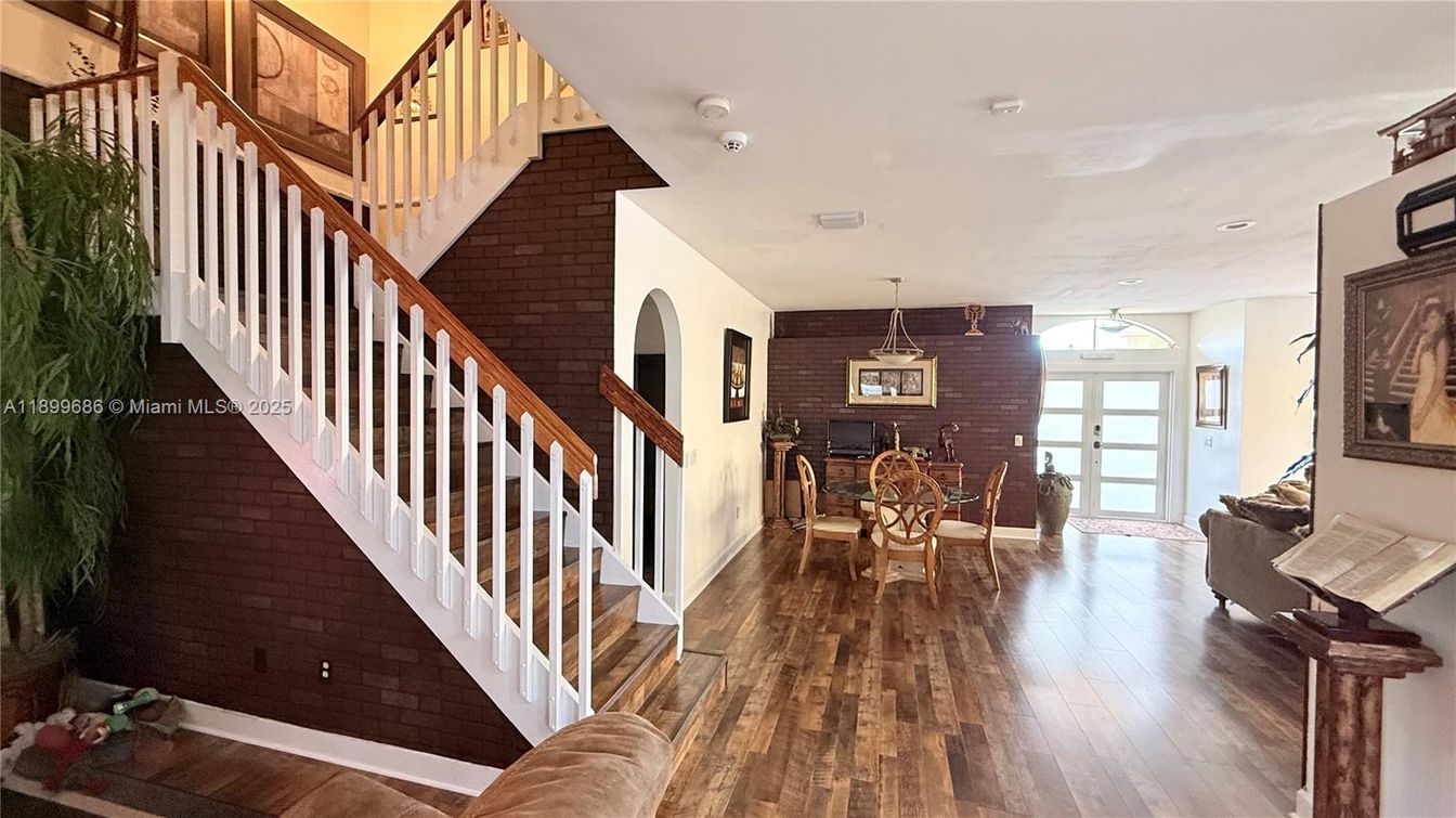 Dining room, Fireplace, Interior, Pendant Lights, Recessed Lighting, Stone Walls, Wood Texture Flooring