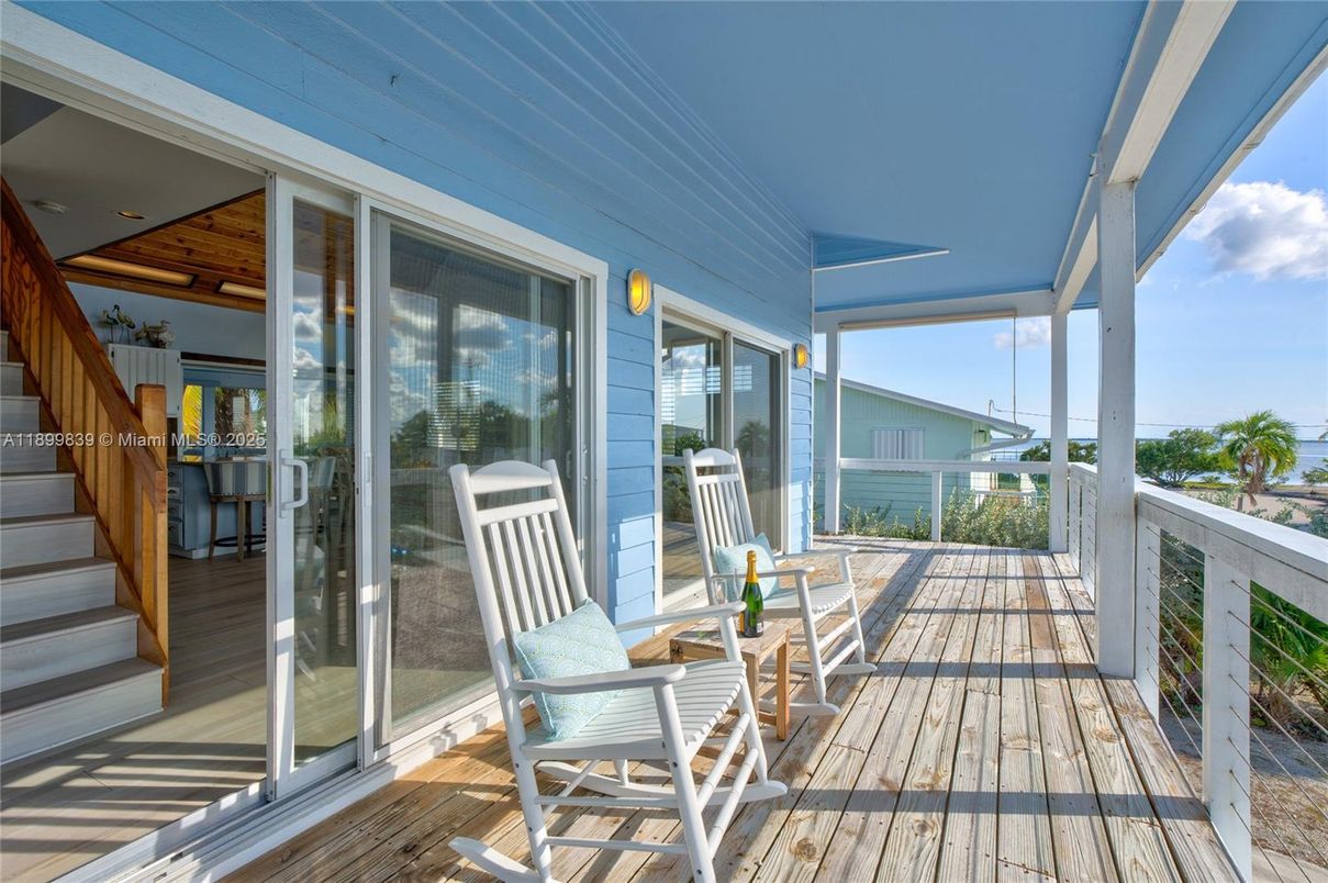Exterior, Sun Room, Water, Wood Texture Flooring