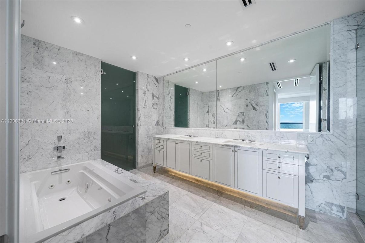 Bathroom, Dual Sink Vanities, Glass Shower, Interior, Marble, Marble Walls, Recessed Lighting