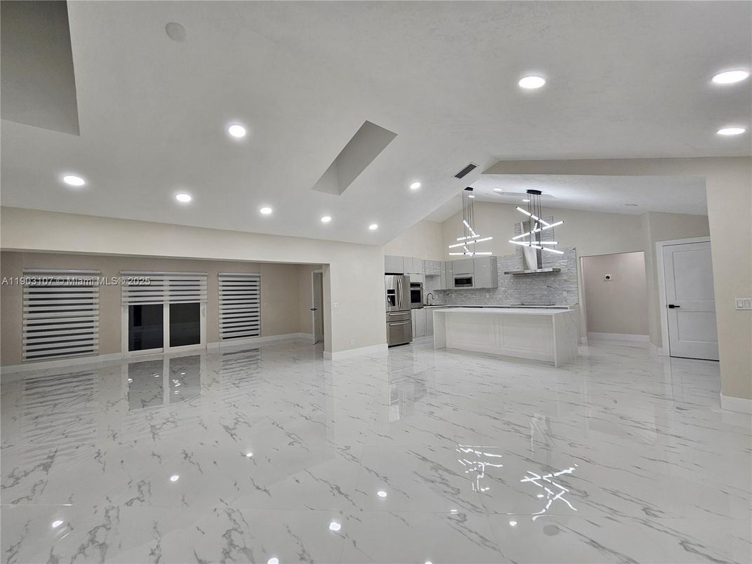 Empty room, Interior, Kitchen, Marble, Pendant Lights, Recessed Lighting, Stainless Steel Appliances